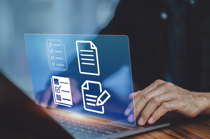 Businessman using computer Document Management System (DMS), online documentation database process automation to efficiently manage files